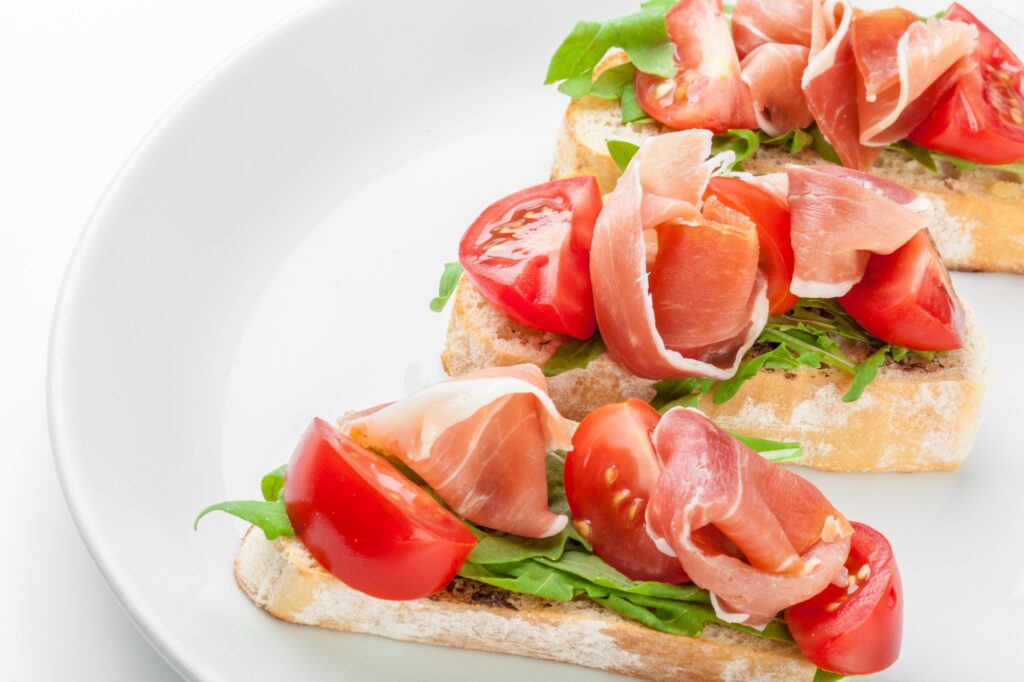 Jamon. Slices of Bread with Spanish Serrano Ham Served as Tapas. Cured ham, spanish appetizer