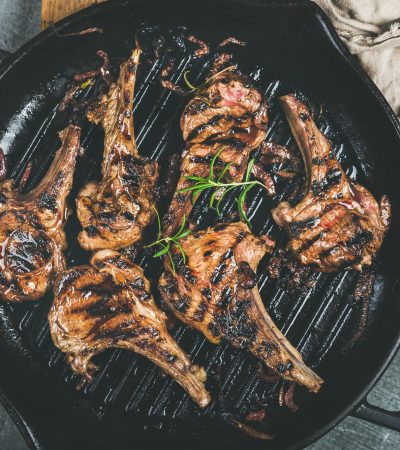 Barbecue dinner with grilled lamb meat chops in pan