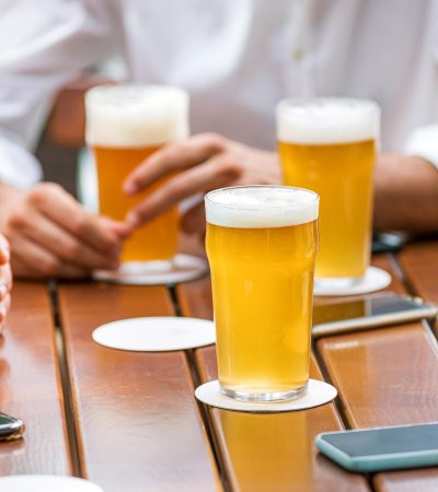 Glasses of ice cold beer on a pub table